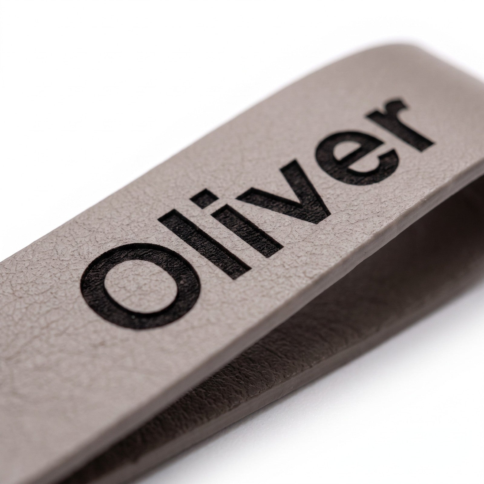 Close-up of the laser engraving on the leather keyring
