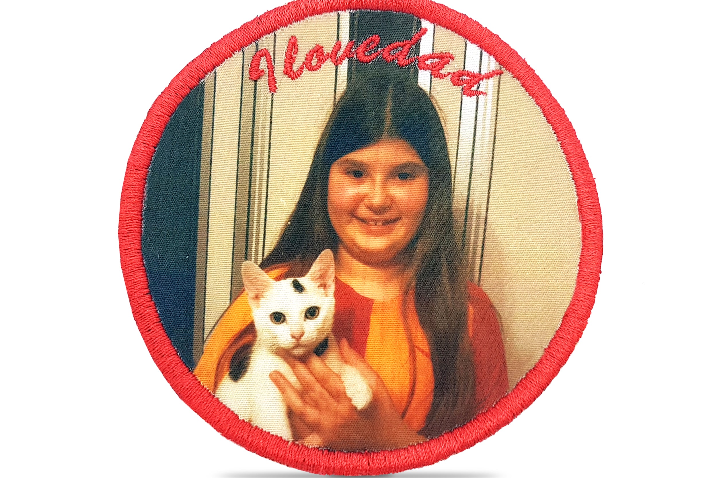 Custom embroidered patch featuring a printed photo of a girl holding a cat with vibrant colors and unique design.