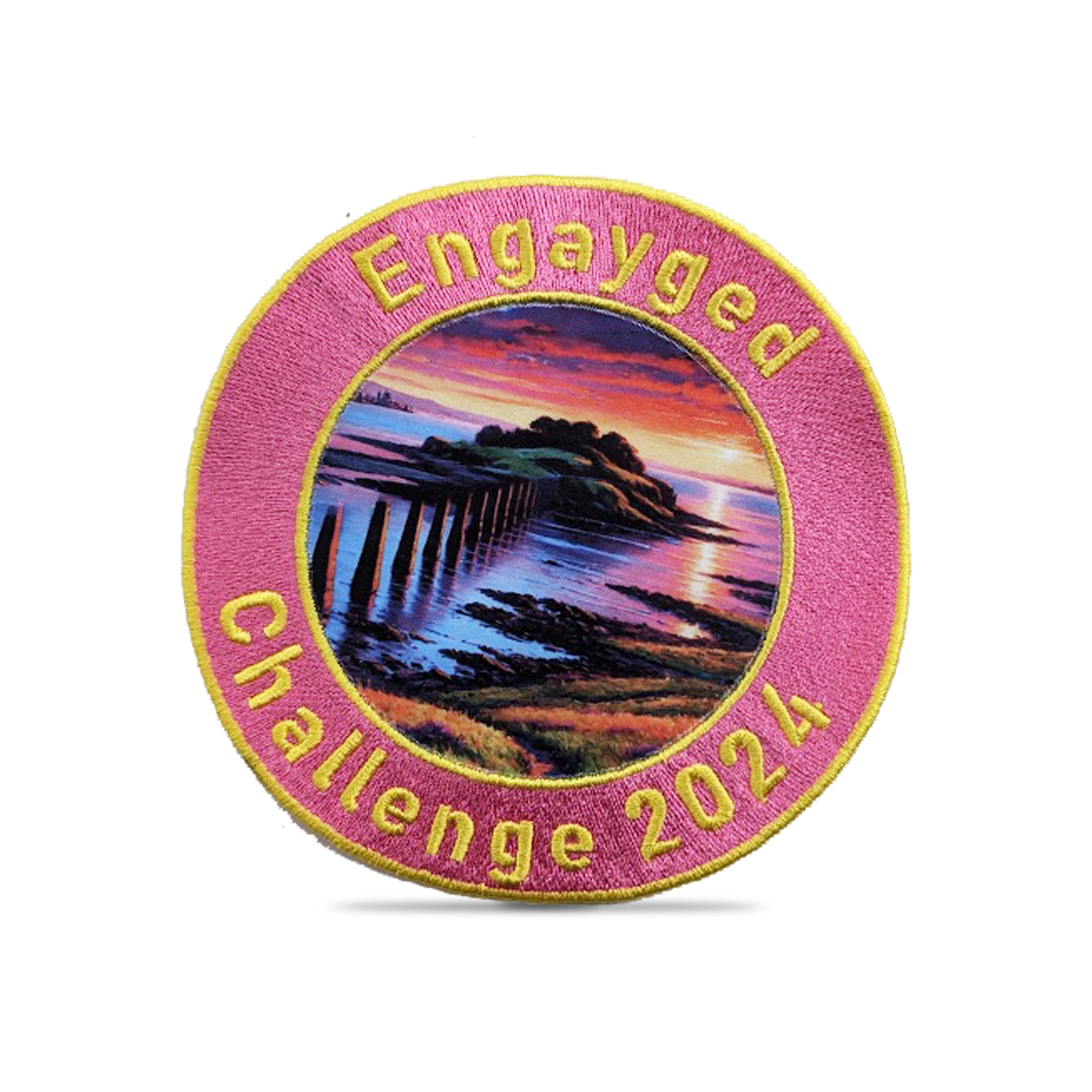 Circular embroidered patch featuring a scenic sunset with text "Engayged Challenge 2024" and vibrant colors.