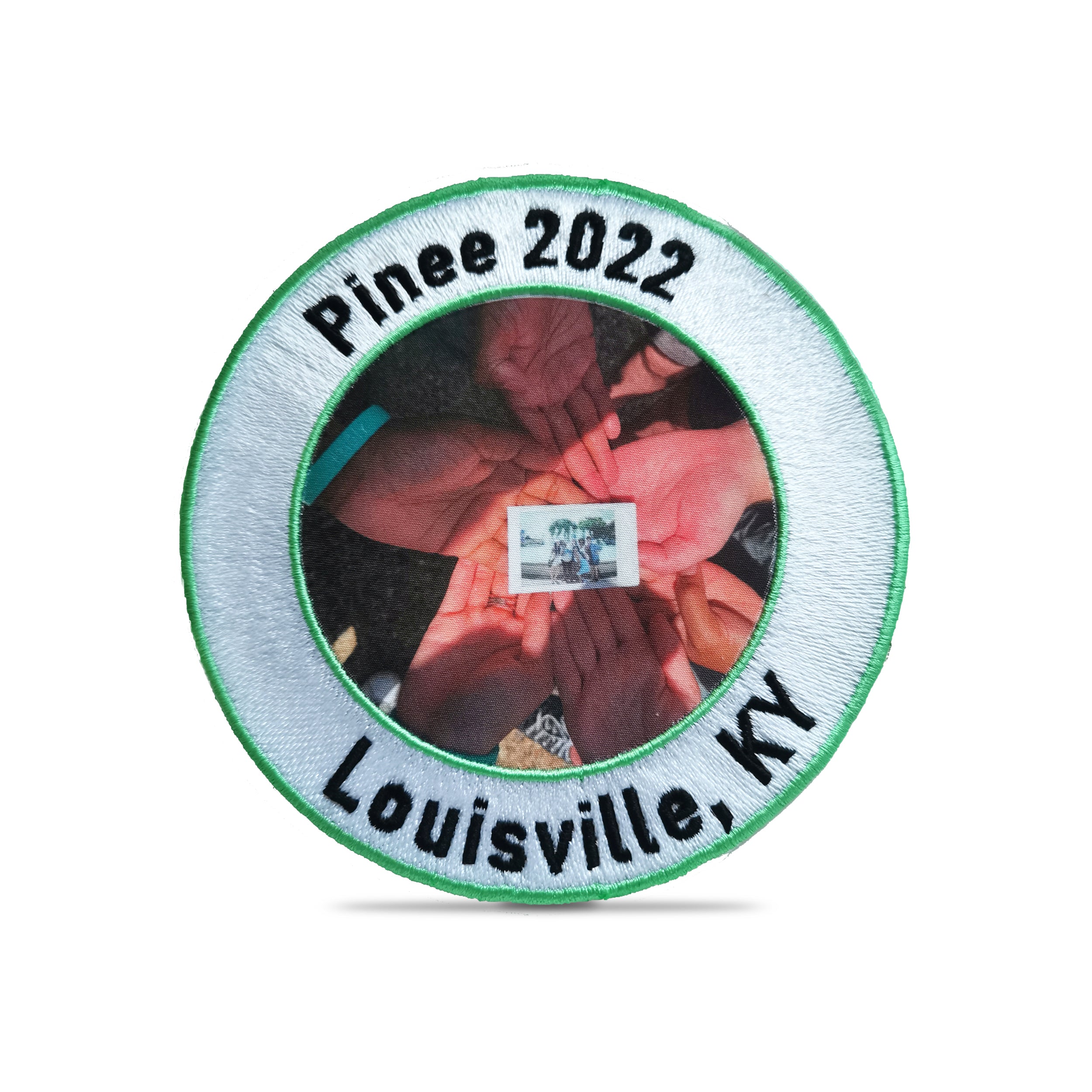 Circle embroidered patch featuring hands holding a photo, labeled 'Pinee 2022, Louisville, KY'.