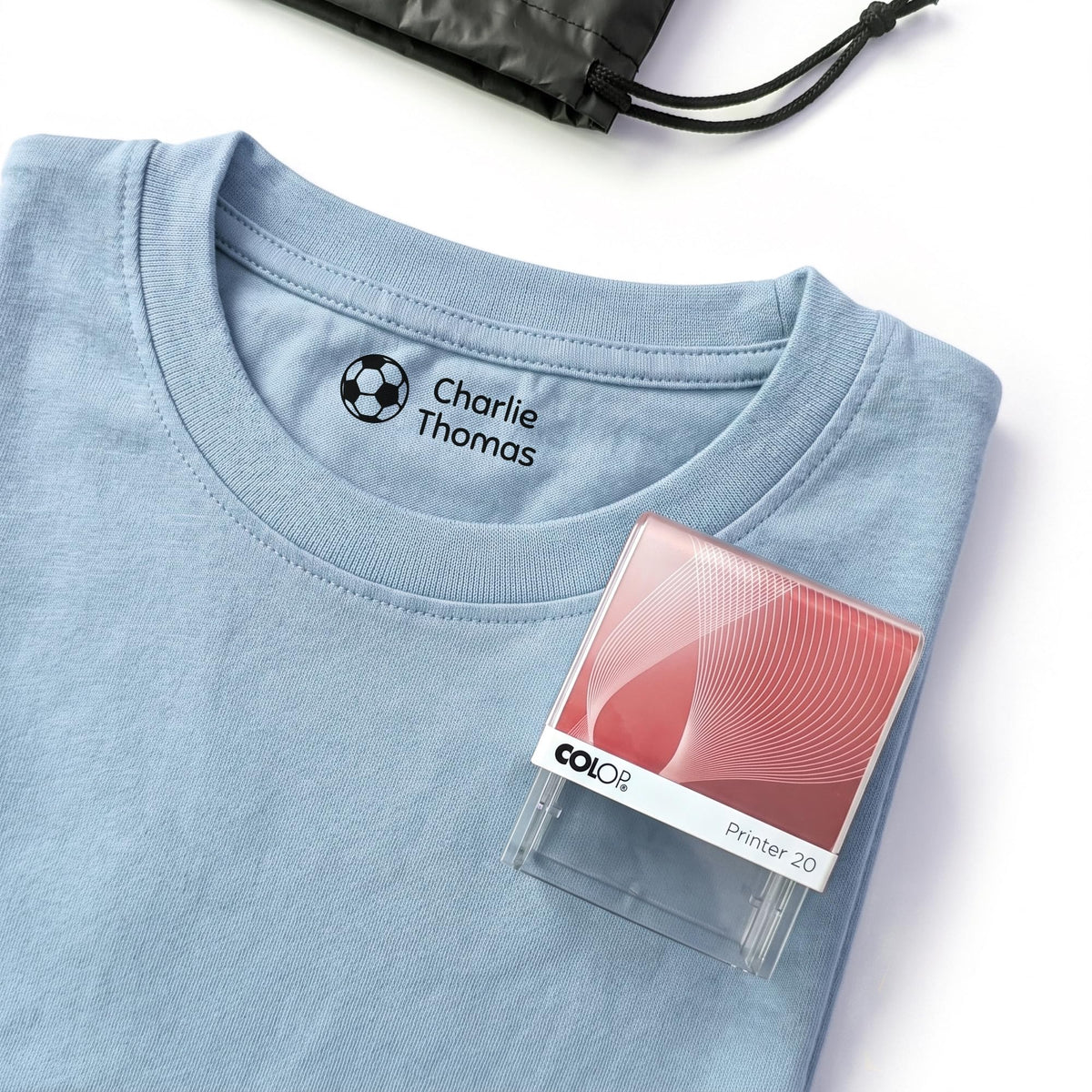 Kids name stamp print on a school uniform collar label