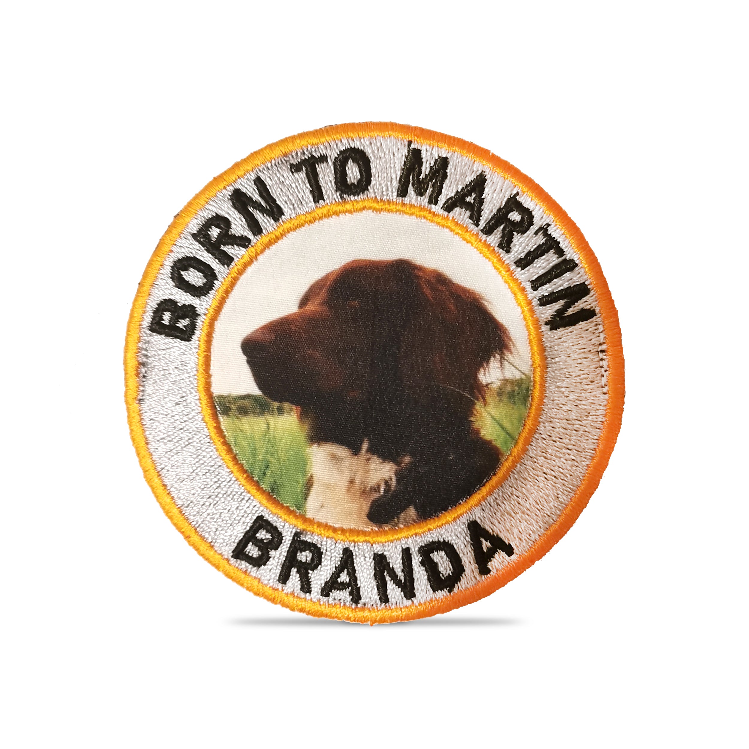 Custom embroidered patch with a dog's portrait and text 'Born to Martin Branda', perfect for jacket or bag decoration.