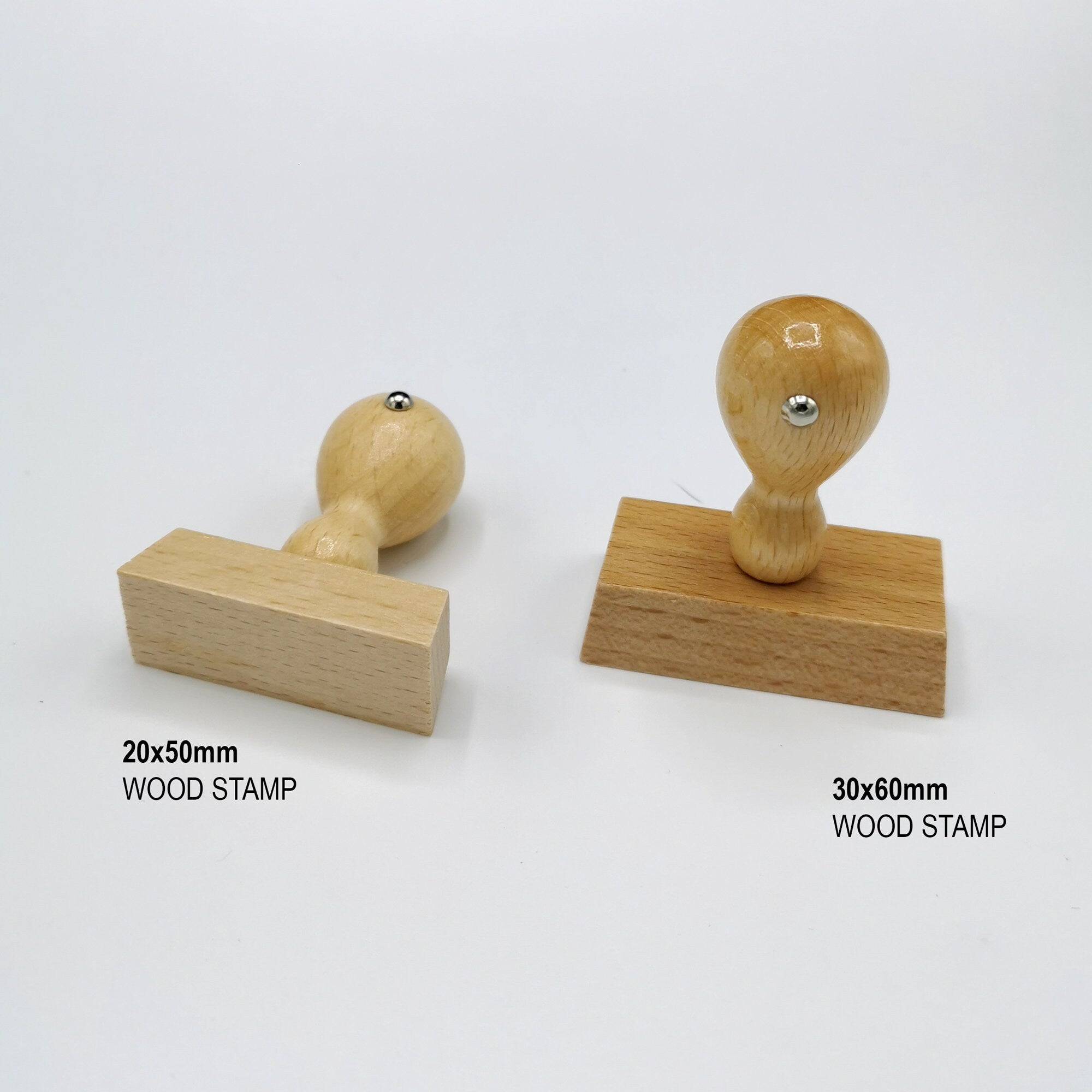 Two wooden handle rubber stamps: one sized 20x50mm and the other 30x60mm for custom address stamping.