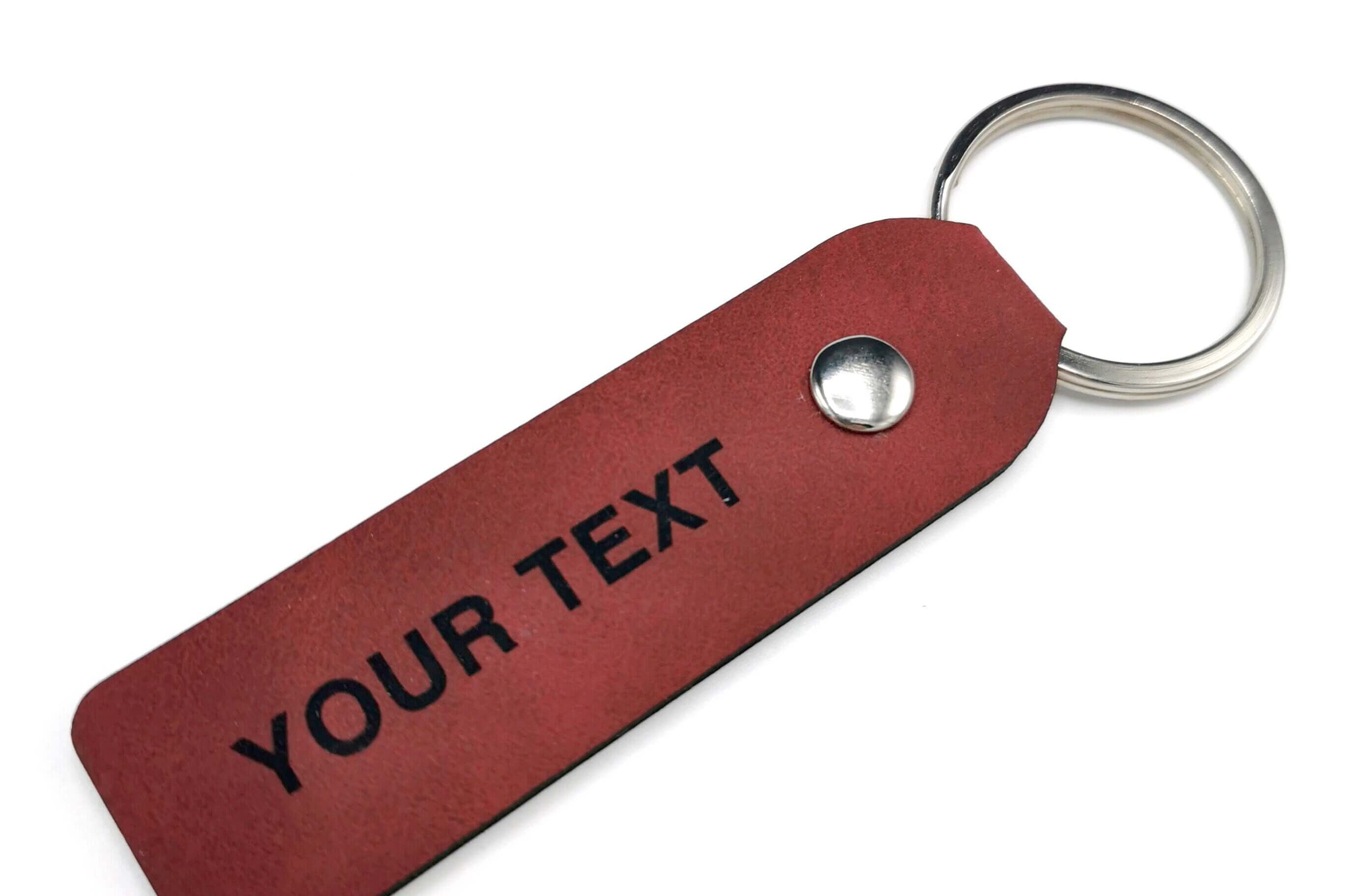 Custom leather keyring with personalized engraving, double-sided for gifts for him or her.