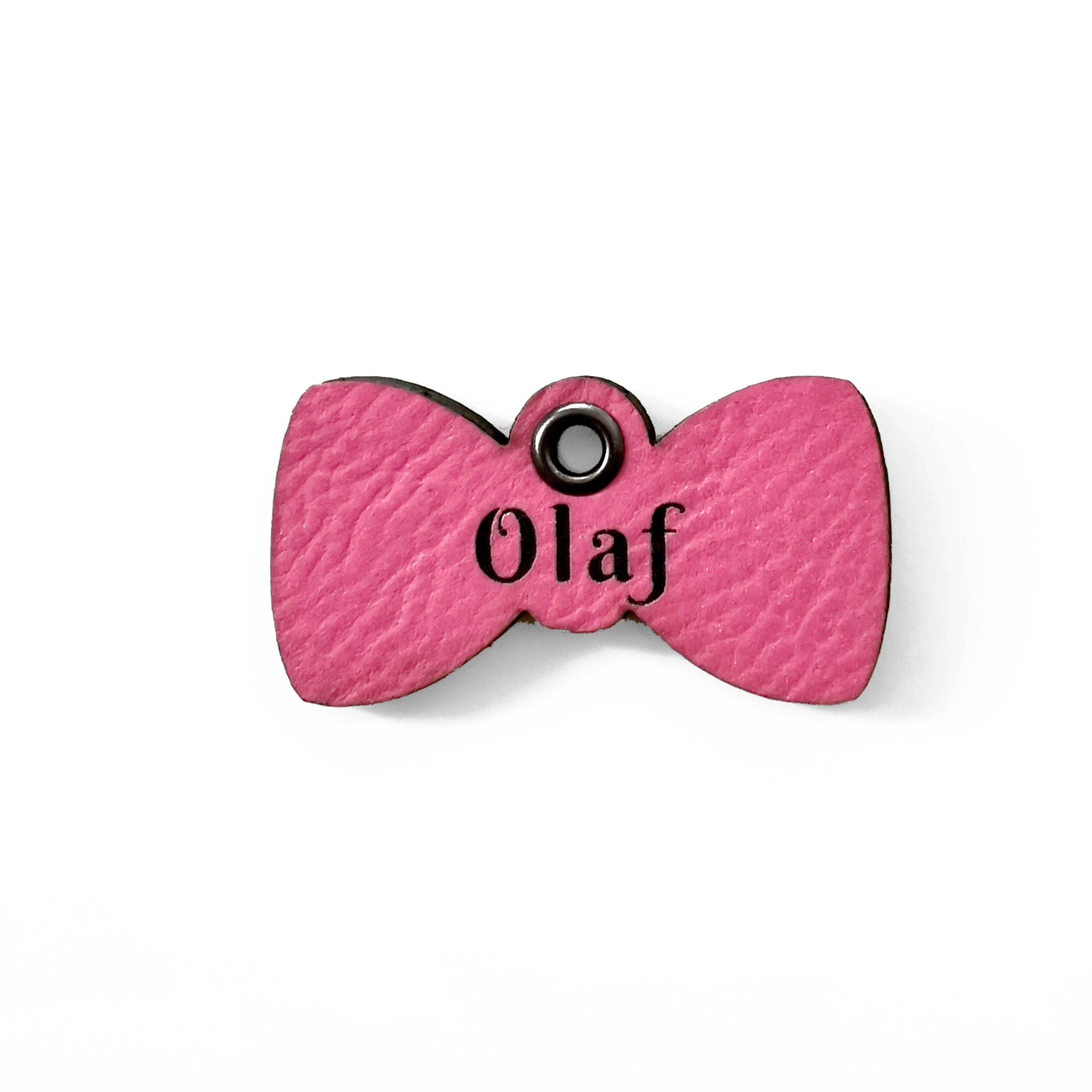 Custom pink leather cat name tag with bow tie design, personalized with the name 'Olaf'.