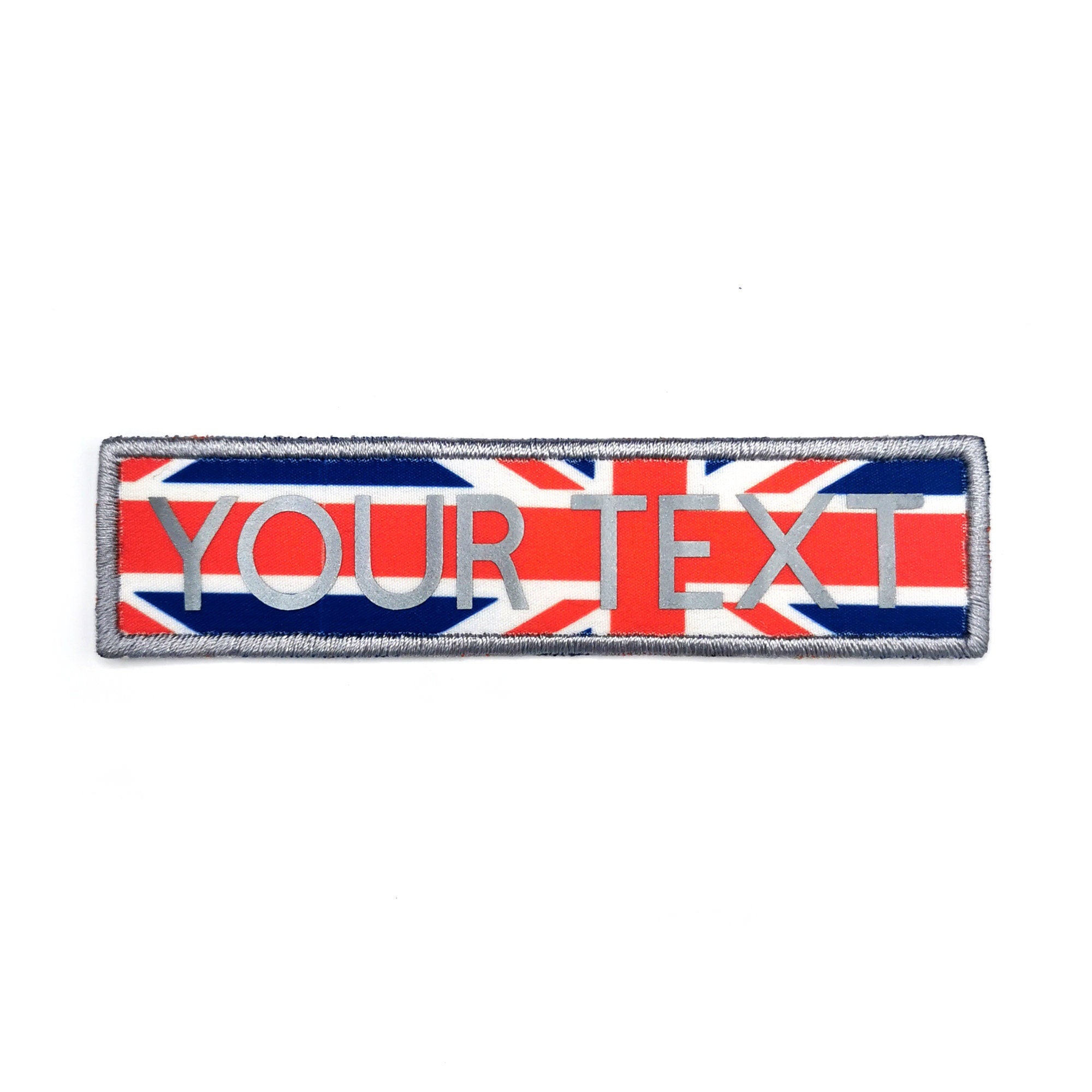 Custom reflective iron-on patch with embroidered border and printed letters featuring a Union Jack design.