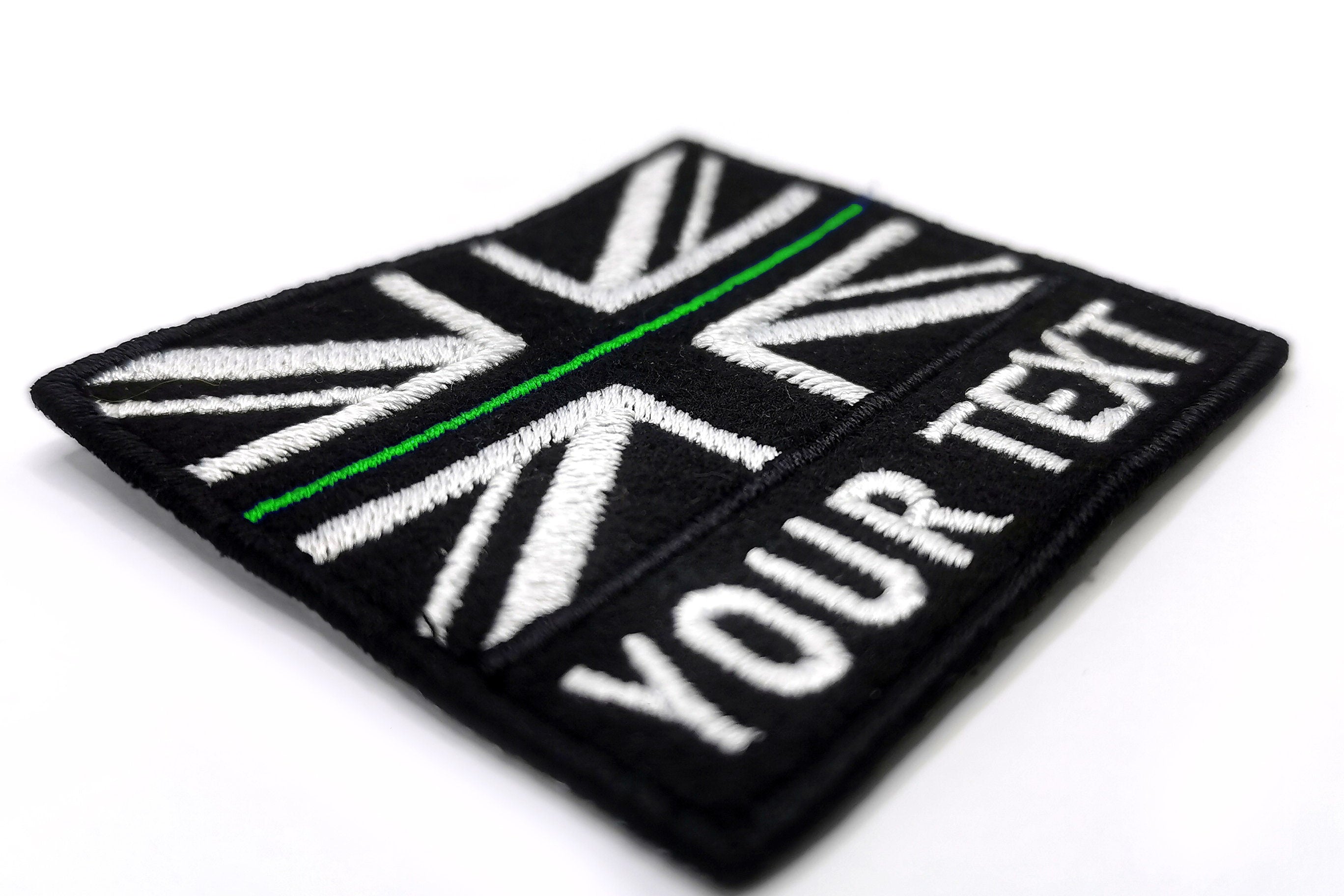 Custom British flag patch with personalized text, embroidered black and white Union Jack design.