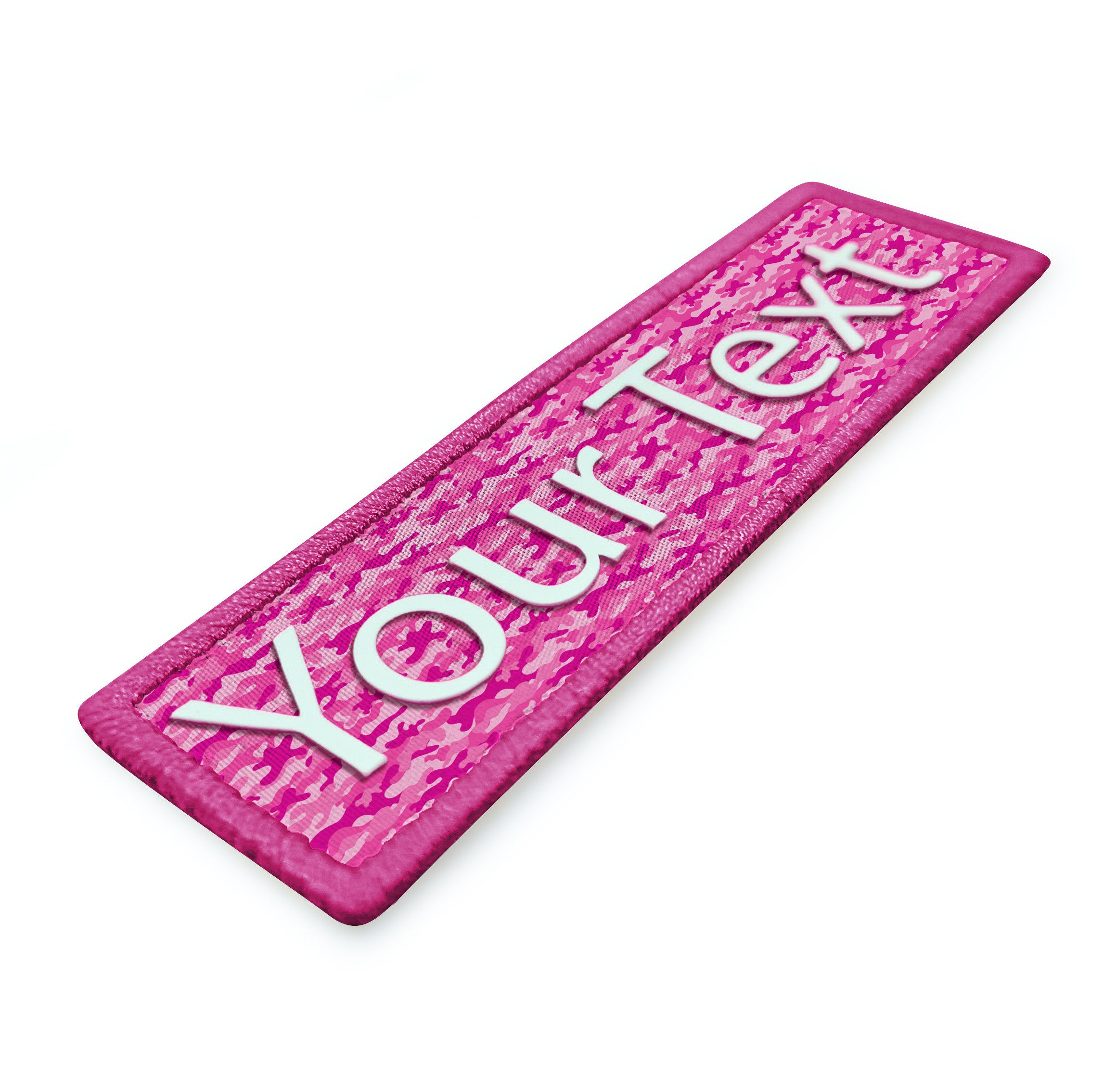 Custom 3D name silicone patch in pink with embroidered lettering on fabric background.