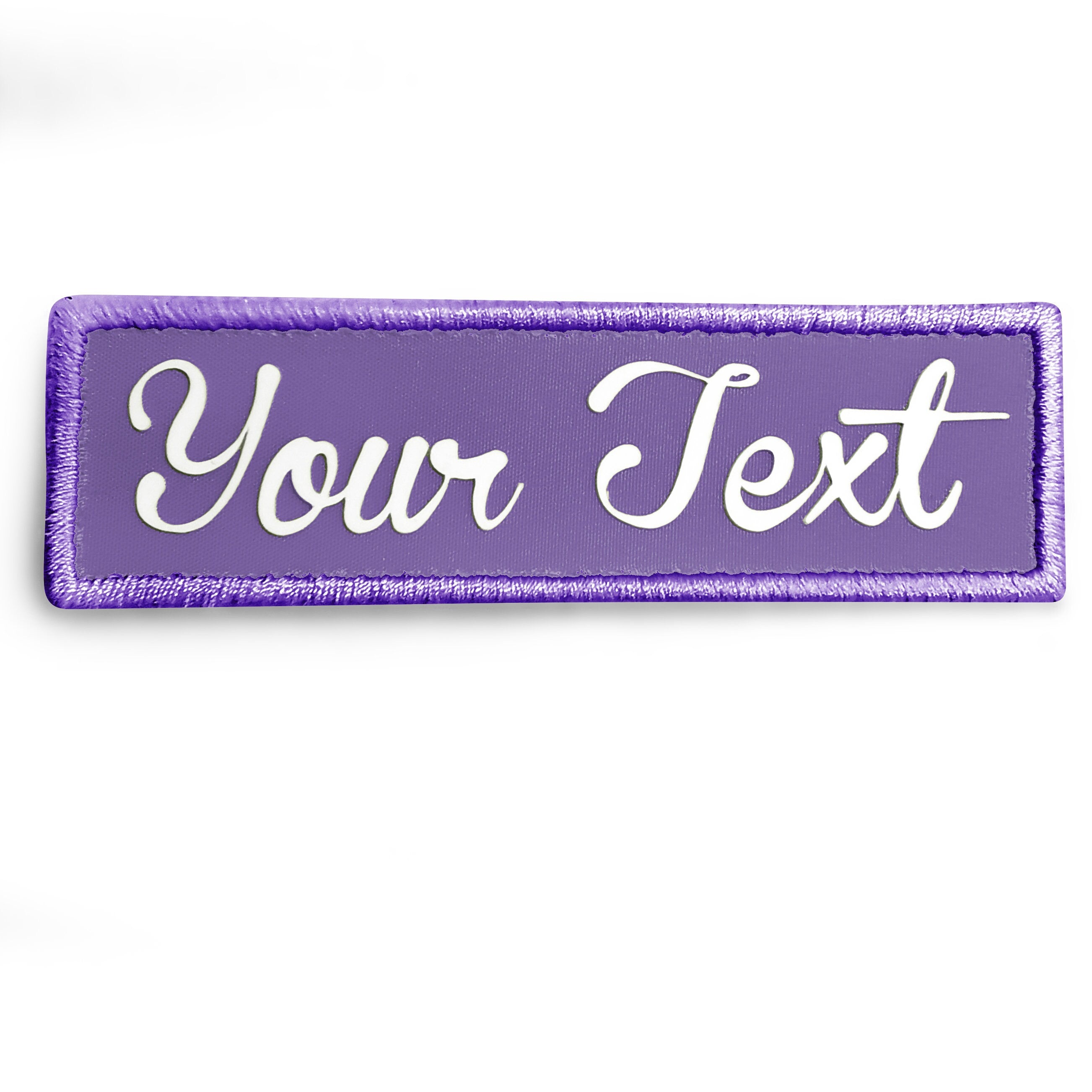Purple custom 3D silicone patch with white text design, perfect for personalizing clothing and accessories.