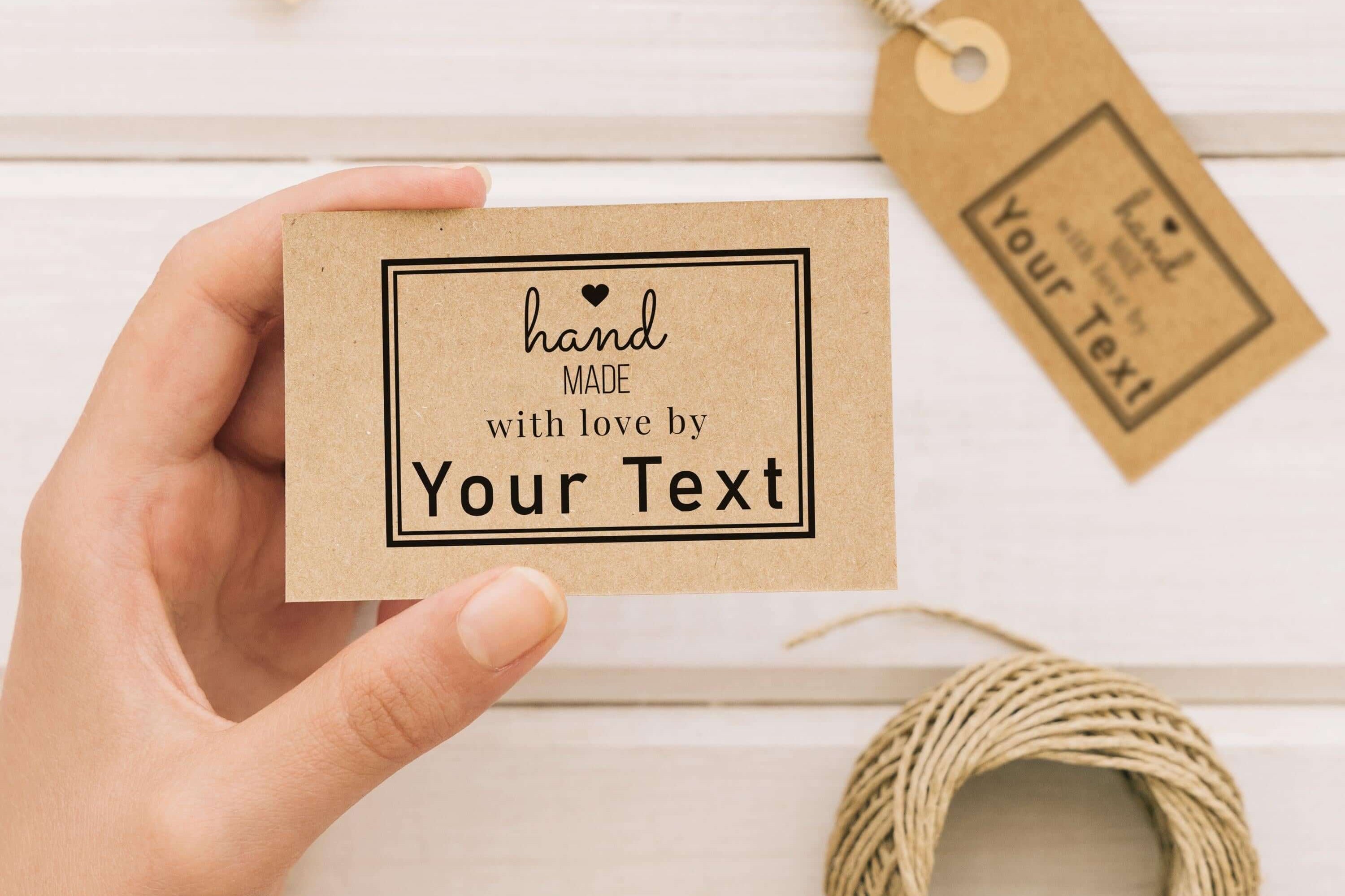 Personalised handmade stamp held by a hand, featuring customizable text for DIY projects and gifts.