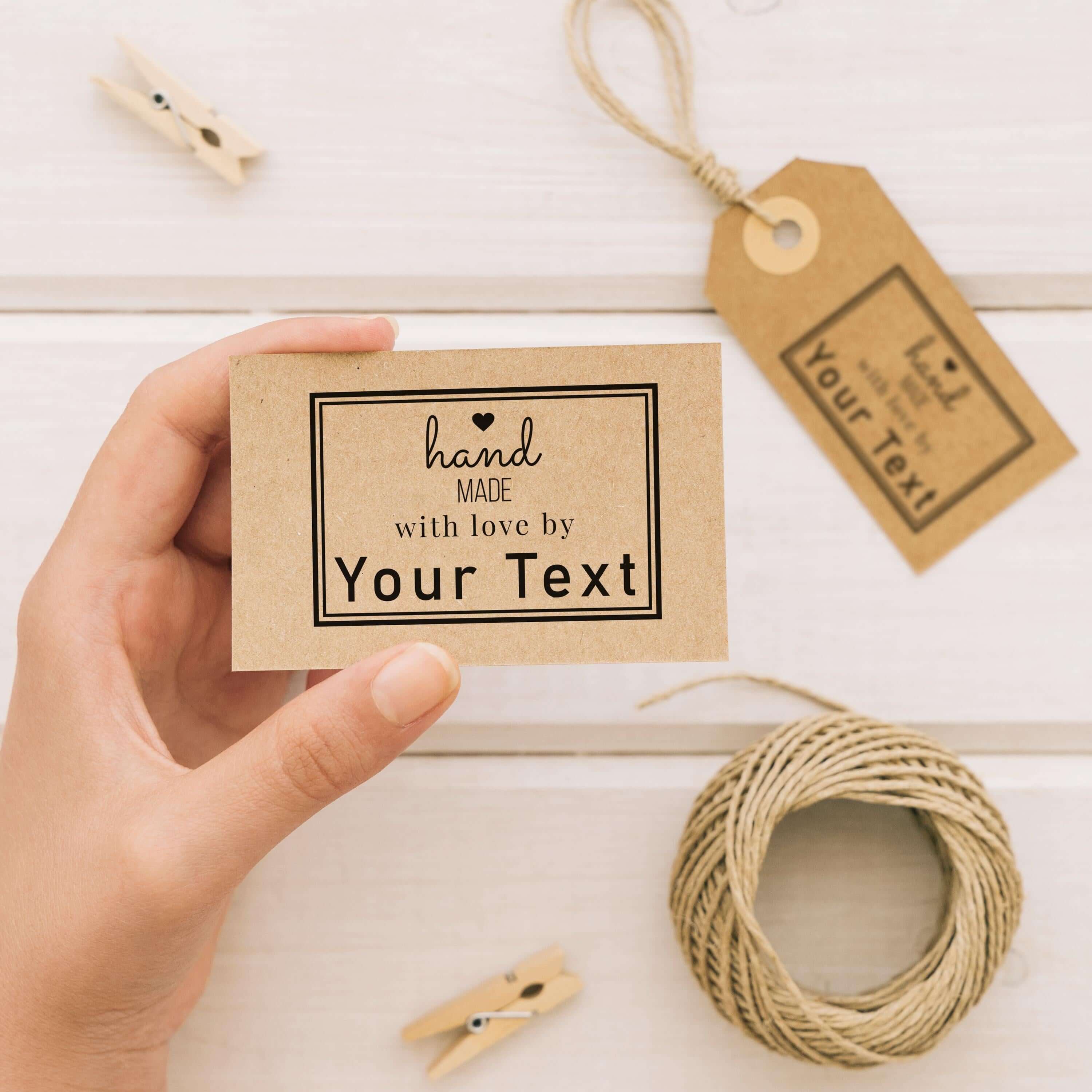 Personalised handmade stamp held by a hand, featuring customizable text for DIY projects and gifts.