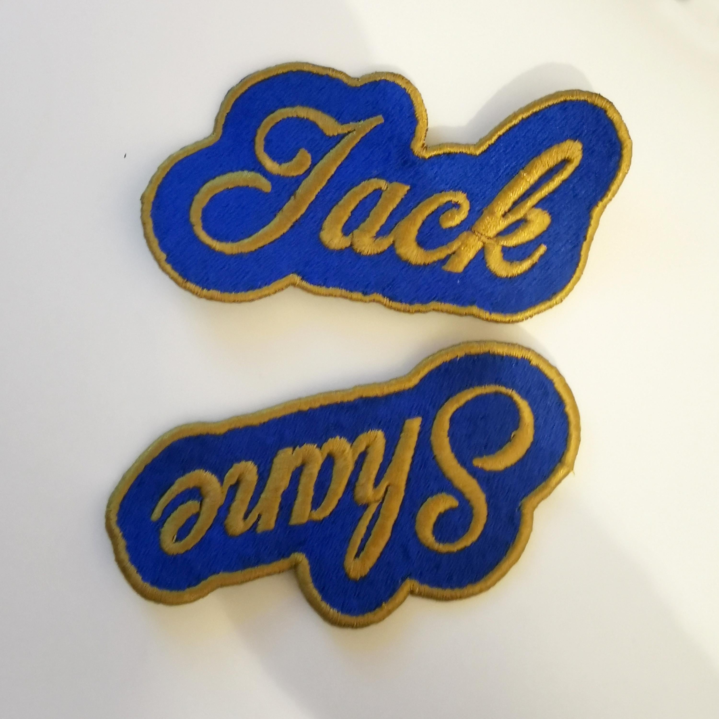 Personalized blue embroidered patches with gold lettering for names Jack and Sarah.
