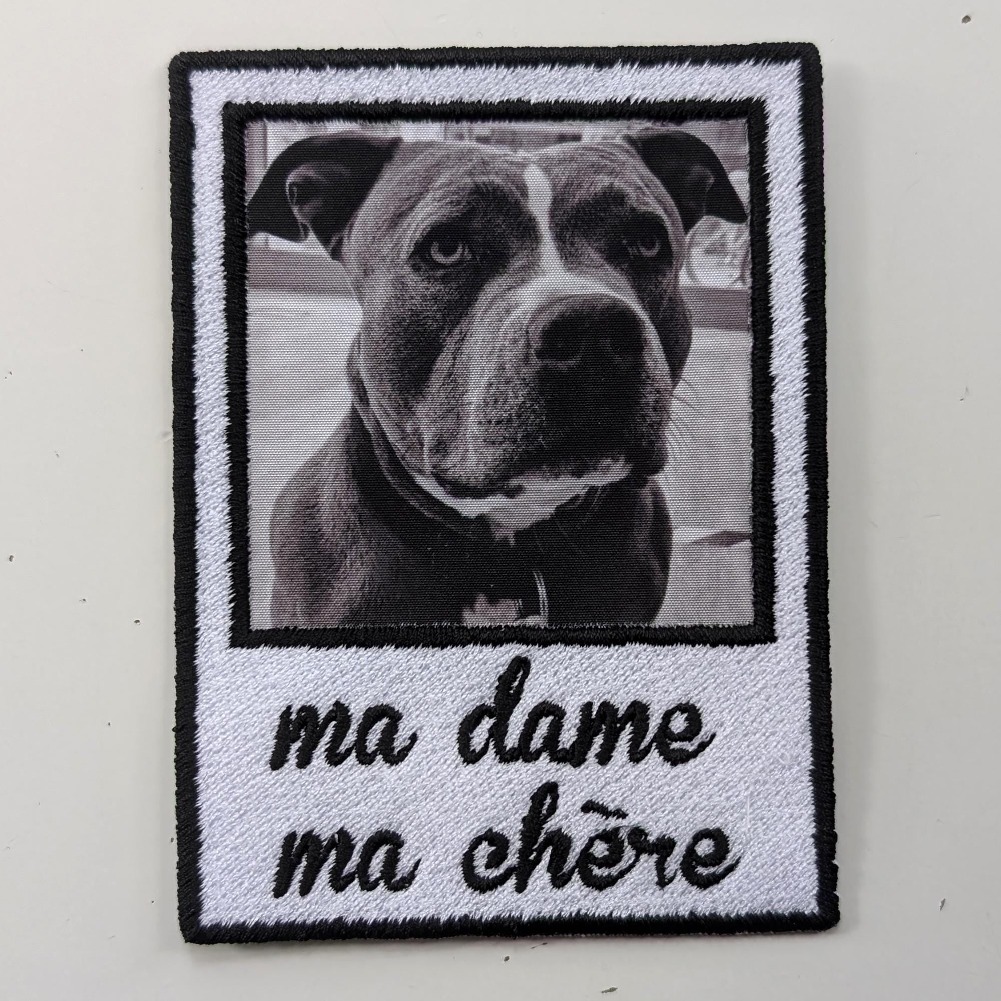 Handwritten embroidered patch featuring a dog photo with text 'ma dame ma chére', a unique memorial gift.