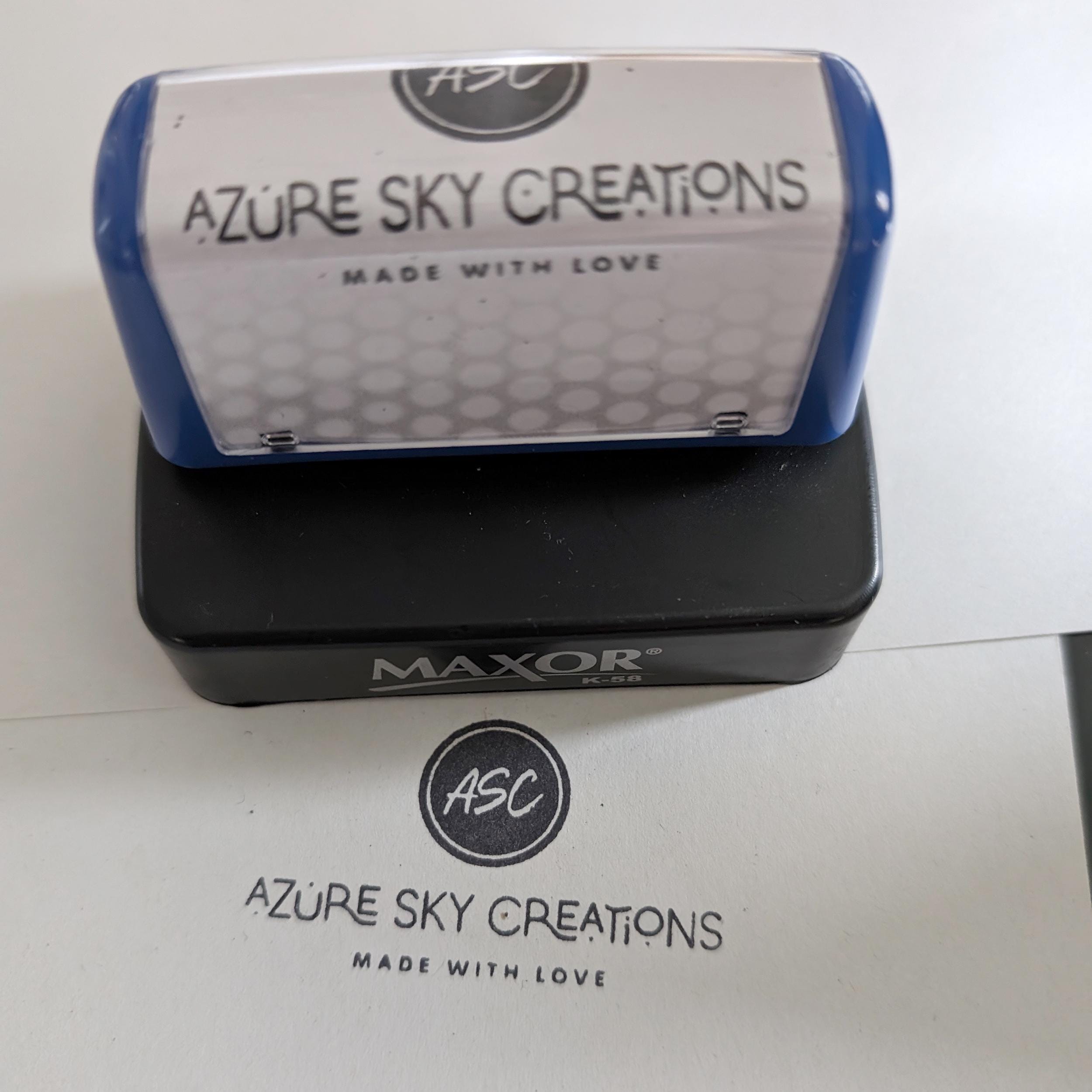 Custom pre-inked logo stamp for branding, featuring 'Azure Sky Creations' design and self-inking functionality.