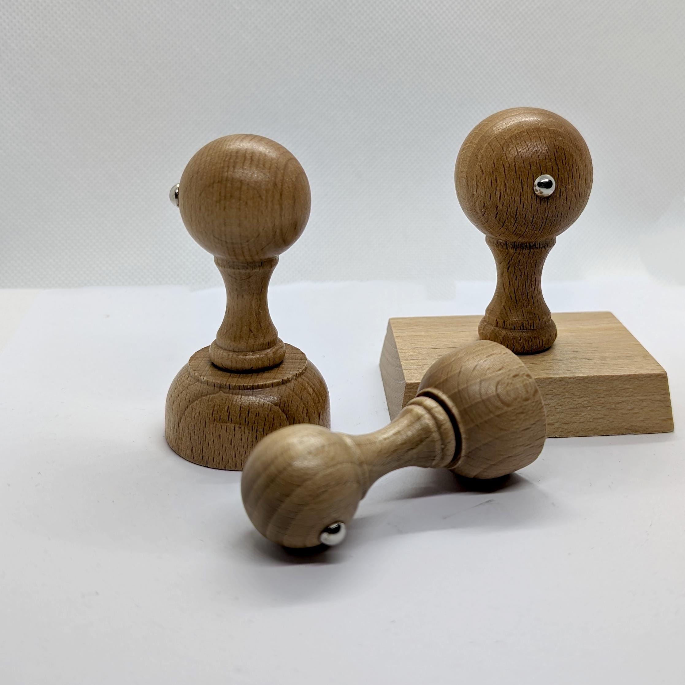 Custom wooden stamps for branding and artwork, showcasing various styles and designs.