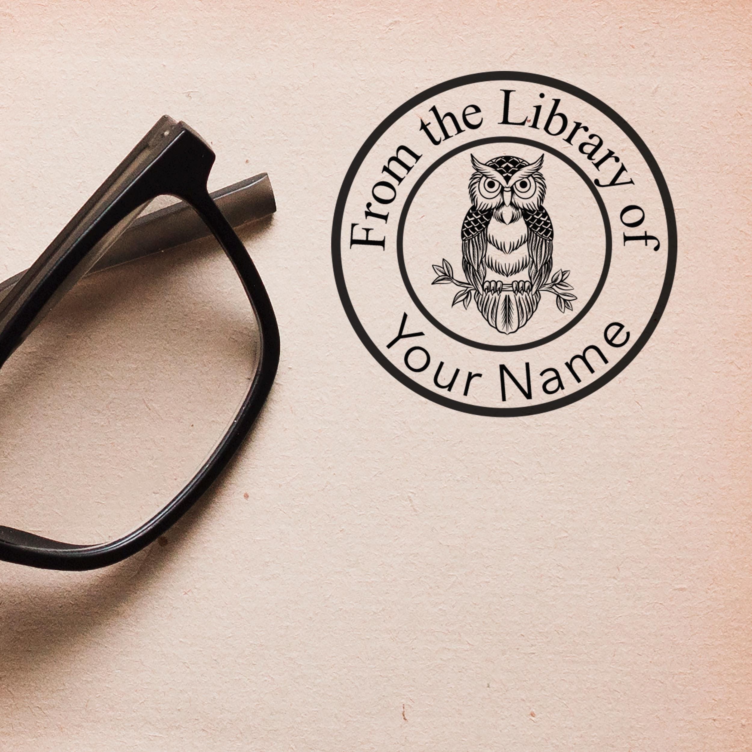 Personalised library stamp featuring an owl design with 'From the Library of Your Name' text beside glasses.
