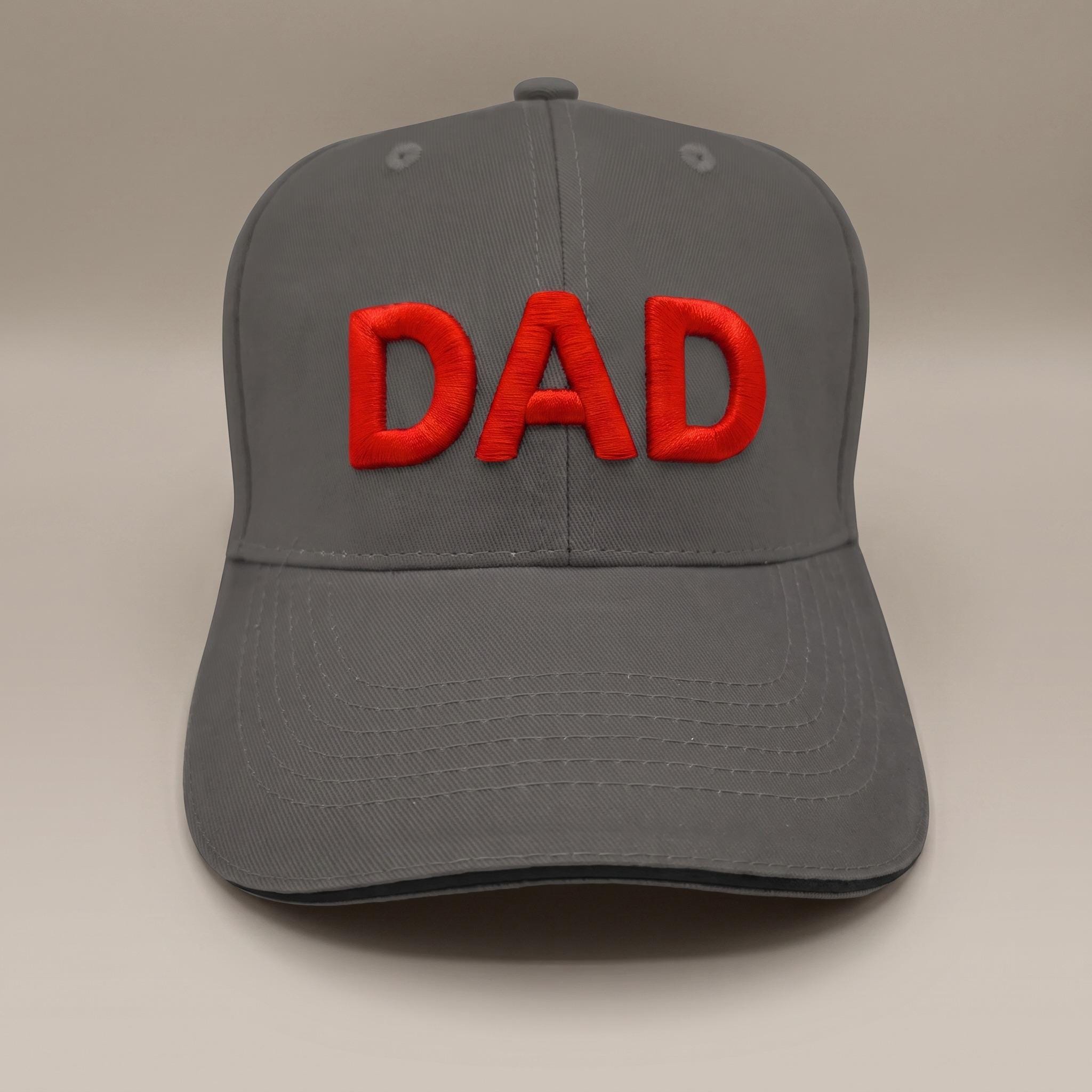 Personalised grey 3D puff embroidered baseball cap with DAD in red, black peak trim, made in the UK