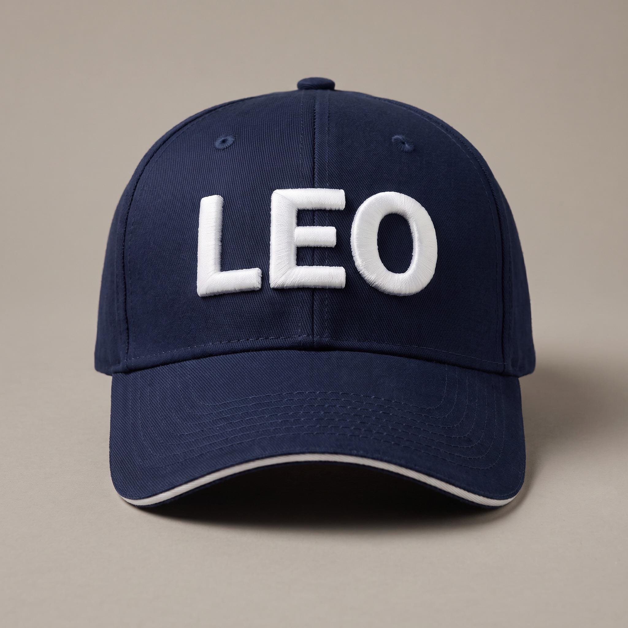 French navy custom baseball cap with the name LEO in white 3D puff embroidery