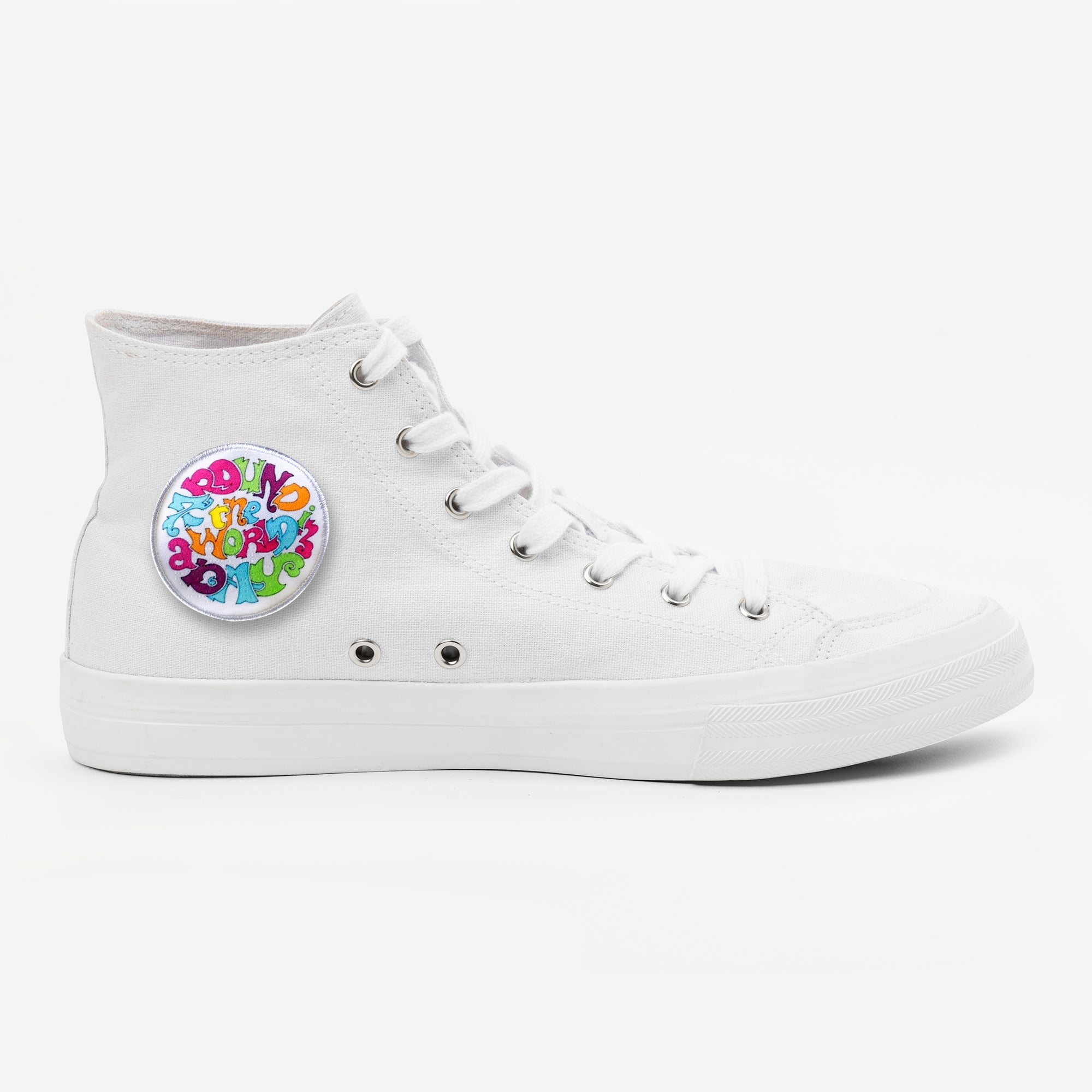 White high-top sneaker with a colorful printed patch on the side, featuring vibrant letters and playful design.