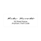 Custom address stamp showcasing handwritten style with name and address details for personalized mail.