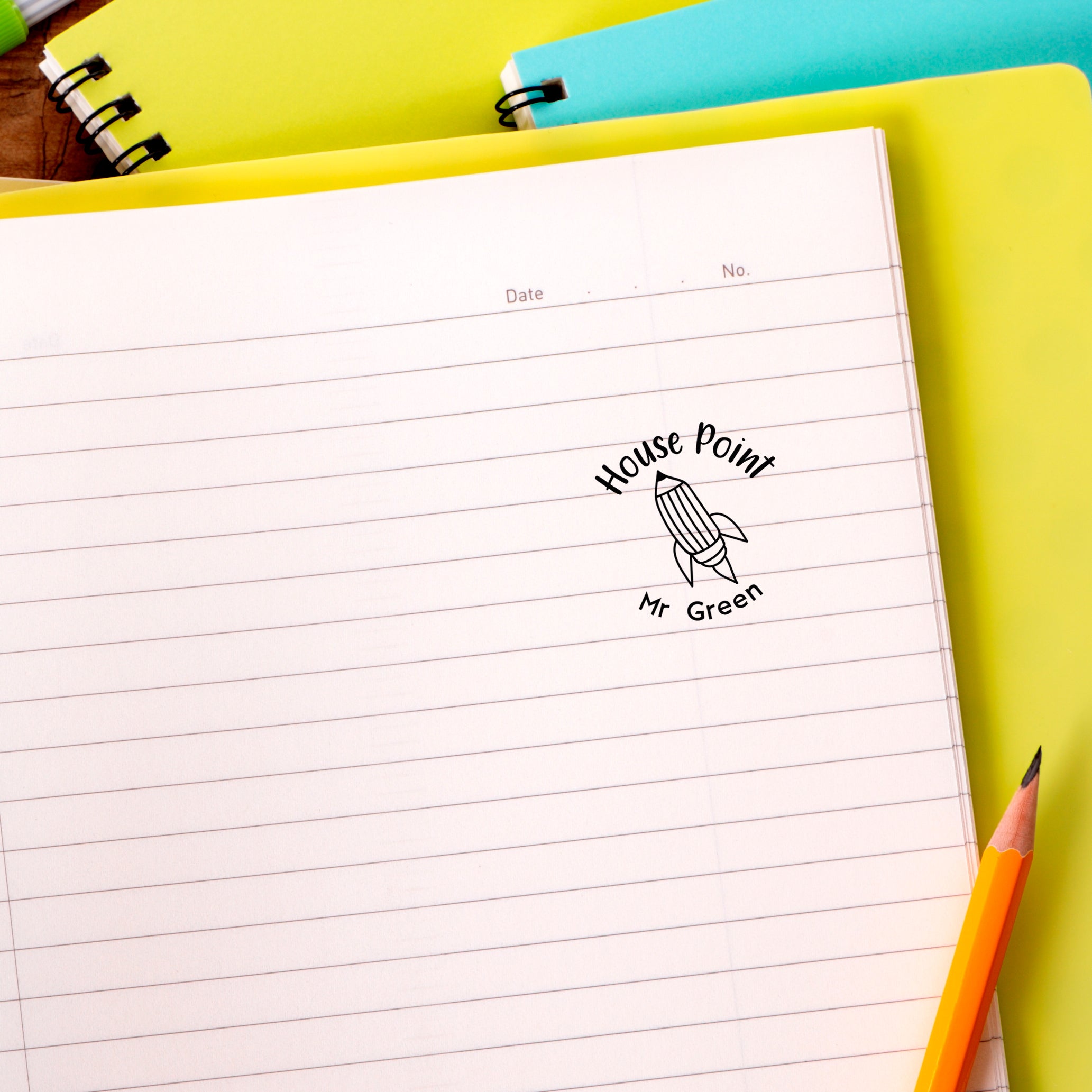 Custom teacher stamp design on notebook, featuring 'House Point' and 'Mr Green', ideal for personalized classroom use.