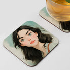 a coaster with a close-up of a woman's face, along with a glass of tea. coaster