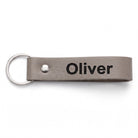 Personalised leather belt loop keyring engraved with a name, grey