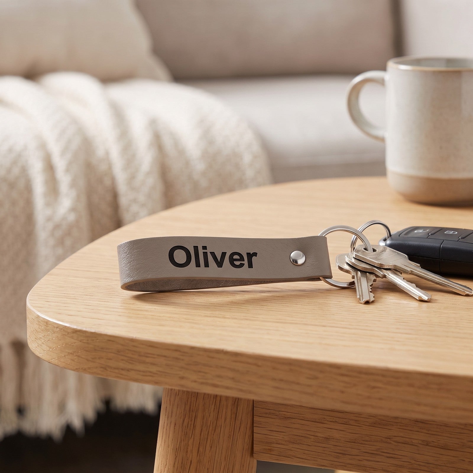 Leather keyring attached to keys on a wooden table