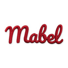 Red 3D raised embroidered name patch reading Mabel, cut to the letter outline, on a white background