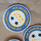 Personalized embroidered patch featuring the text 'Lewis Morse' and stars, highlighting shared history theme.