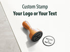 Custom logo stamp with wooden handle for personalized branding and artwork.