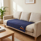 Large personalised dog blanket on sofa seat showing true size