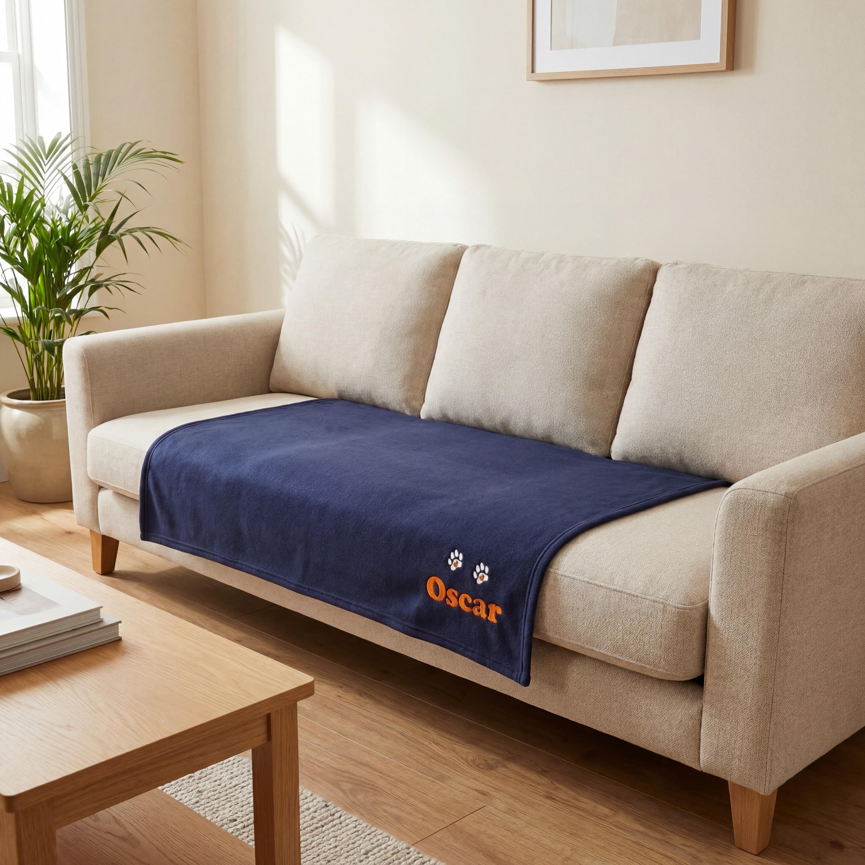 Large personalised dog blanket on sofa seat showing true size