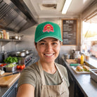 Small business owner wearing a custom cap with their printed logo patch on the front