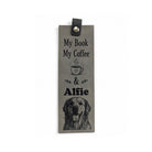Grey vegan leather bookmark engraved with a coffee cup, a pet name and a golden retriever portrait, with a black tab