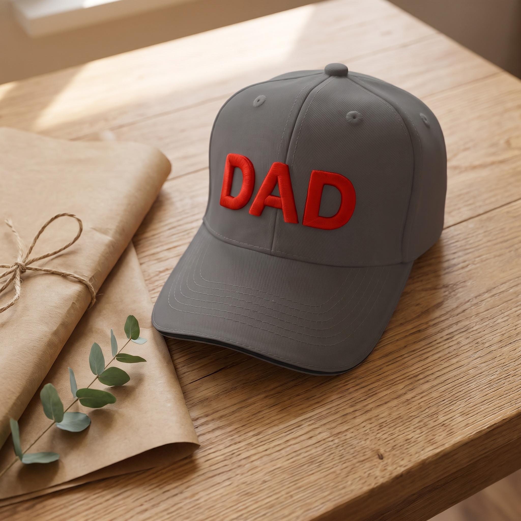 Personalised grey DAD cap styled as a gift with kraft paper and eucalyptus