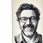 Close-up of a laser engraved portrait on cream vegan leather, showing fine line detail