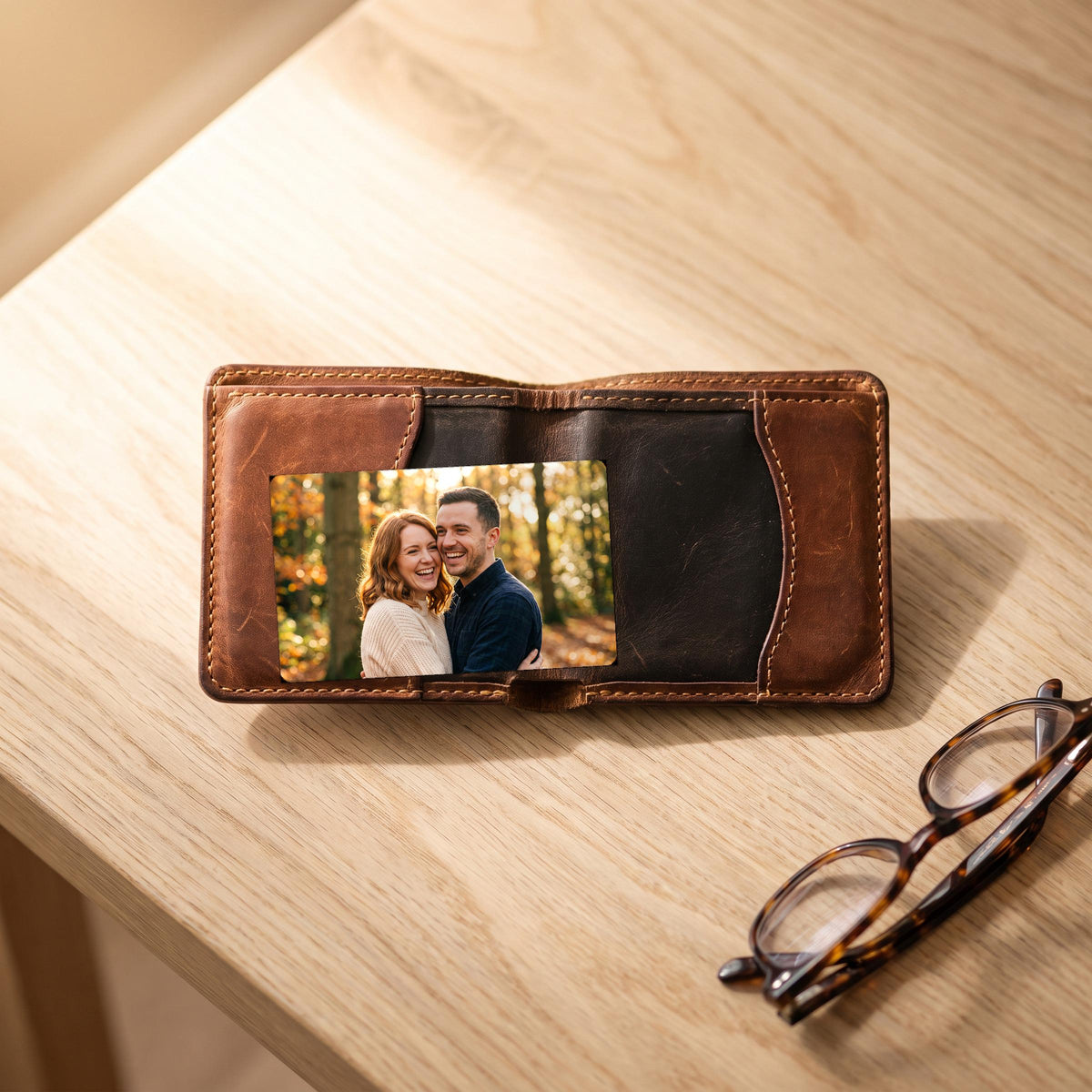 Photo wallet card in the card pocket of an open leather wallet